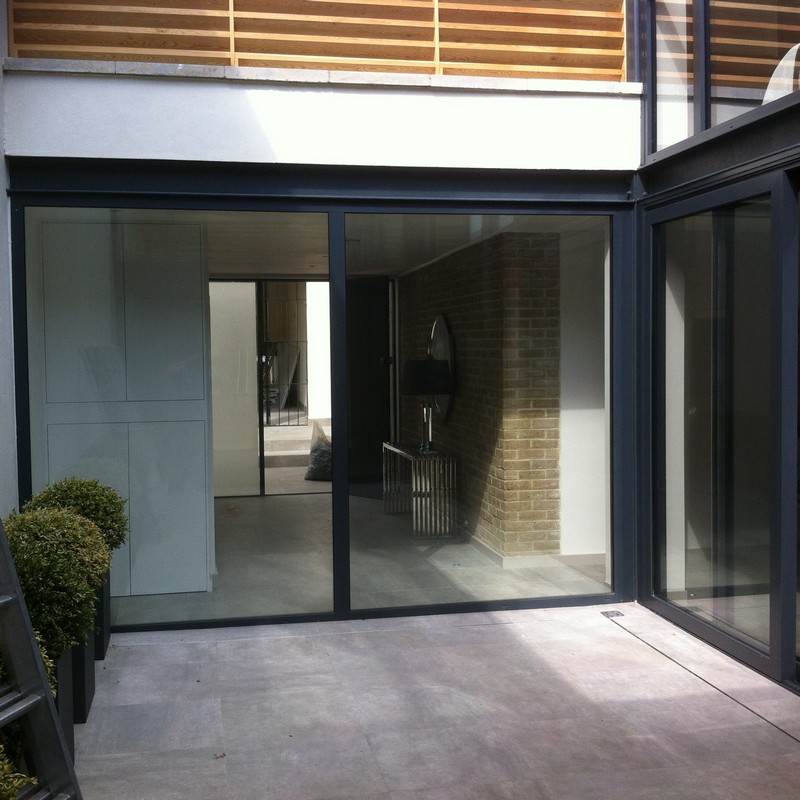 Floor-to-ceiling sliding doors opening to courtyard in Croydon