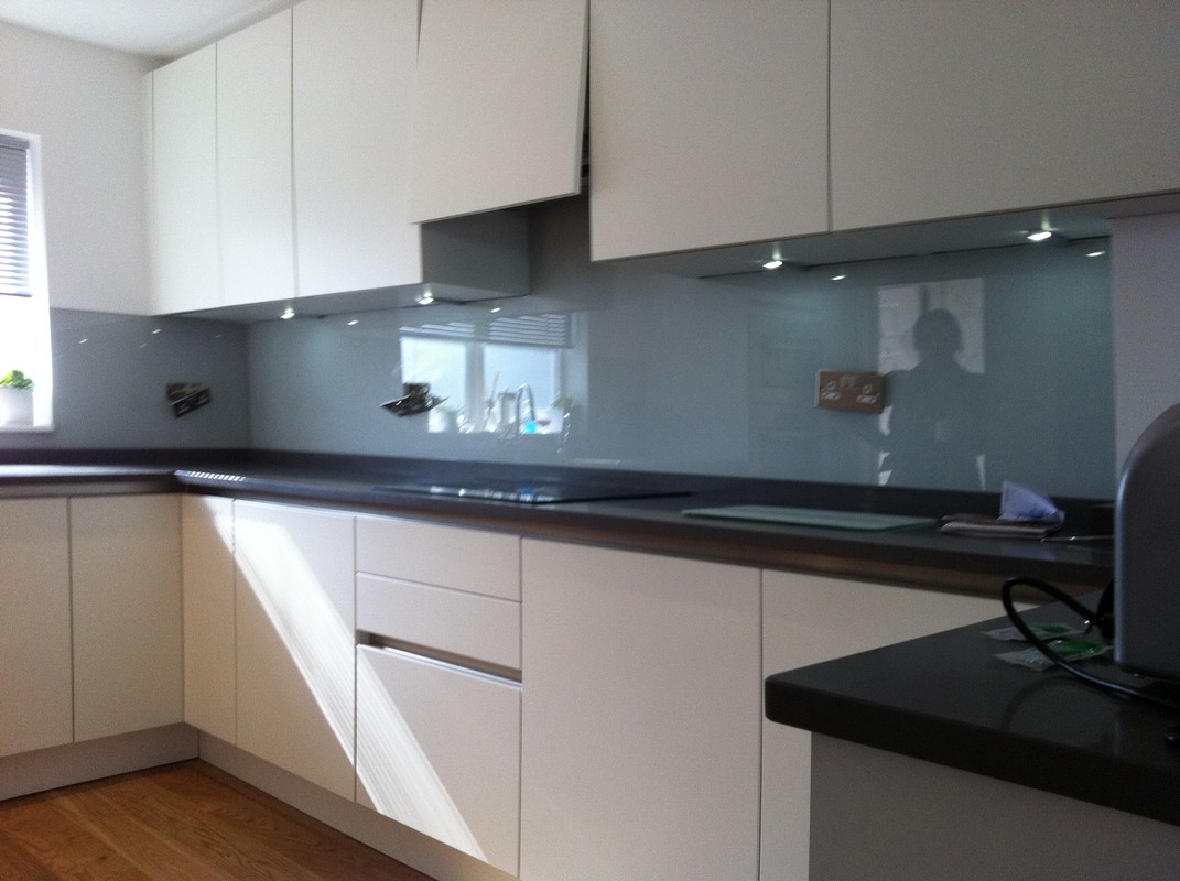 Grey glass kitchen splashback with LED lighting in Croydon