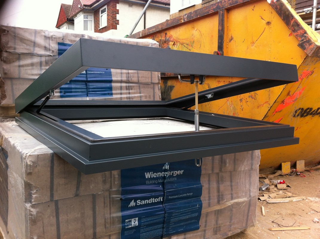Opening flat roof skylight in anthracite grey installed in Croydon